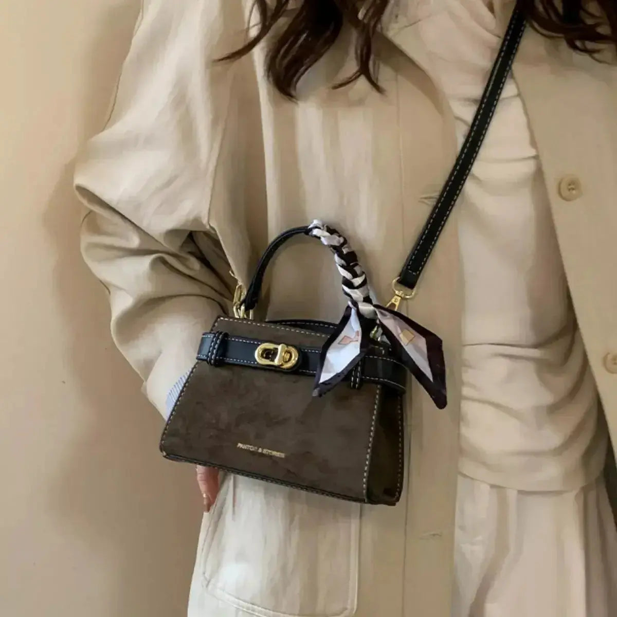 Premium suede mini crossbody bag with adjustable leather strap by Plush Fashion Hub, showcasing its compact design and stylish details.