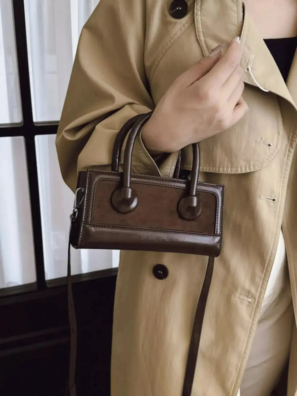 Plush Fashion Hub premium leather top handle crossbody bag with a versatile structured design, featuring a sleek leather finish.