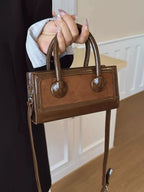 Premium leather top-handle crossbody bag by Plush Fashion Hub, featuring a structured, versatile handbag design.