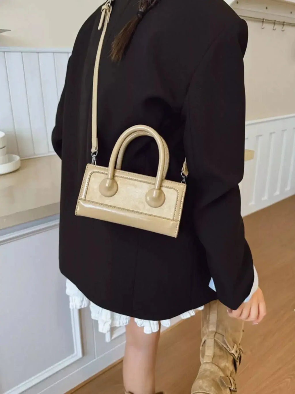 Premium leather top-handle crossbody bag from Plush Fashion Hub, featuring a structured design and versatile carrying options.