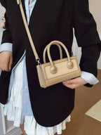 Premium leather top-handle crossbody bag from Plush Fashion Hub, featuring a structured design and versatile style.