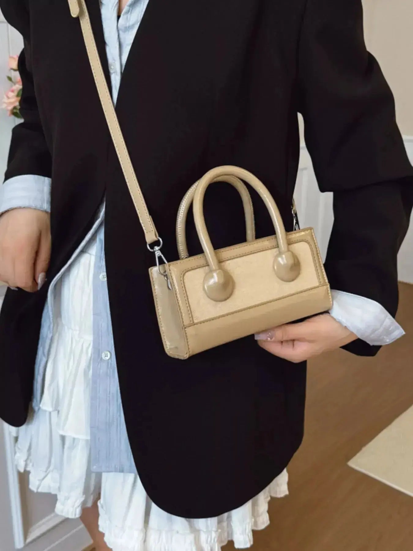 Premium leather top-handle crossbody bag from Plush Fashion Hub, featuring a structured design and versatile style.