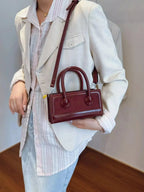 Plush Fashion Hub premium leather top handle crossbody bag with structured design, versatile for daily use and stylish occasions.