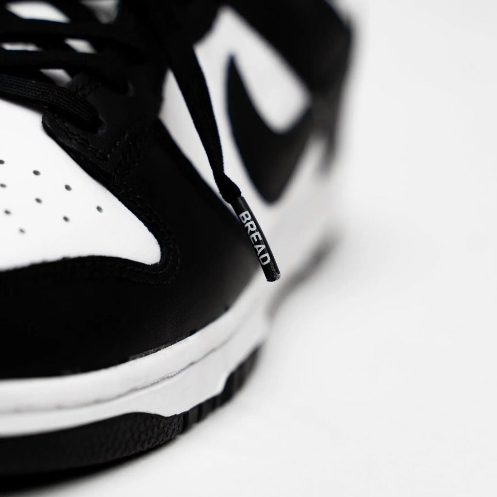 Black elastic shoelaces by Bread, showcasing a close-up of the flexible, durable shoelaces against a neutral background.