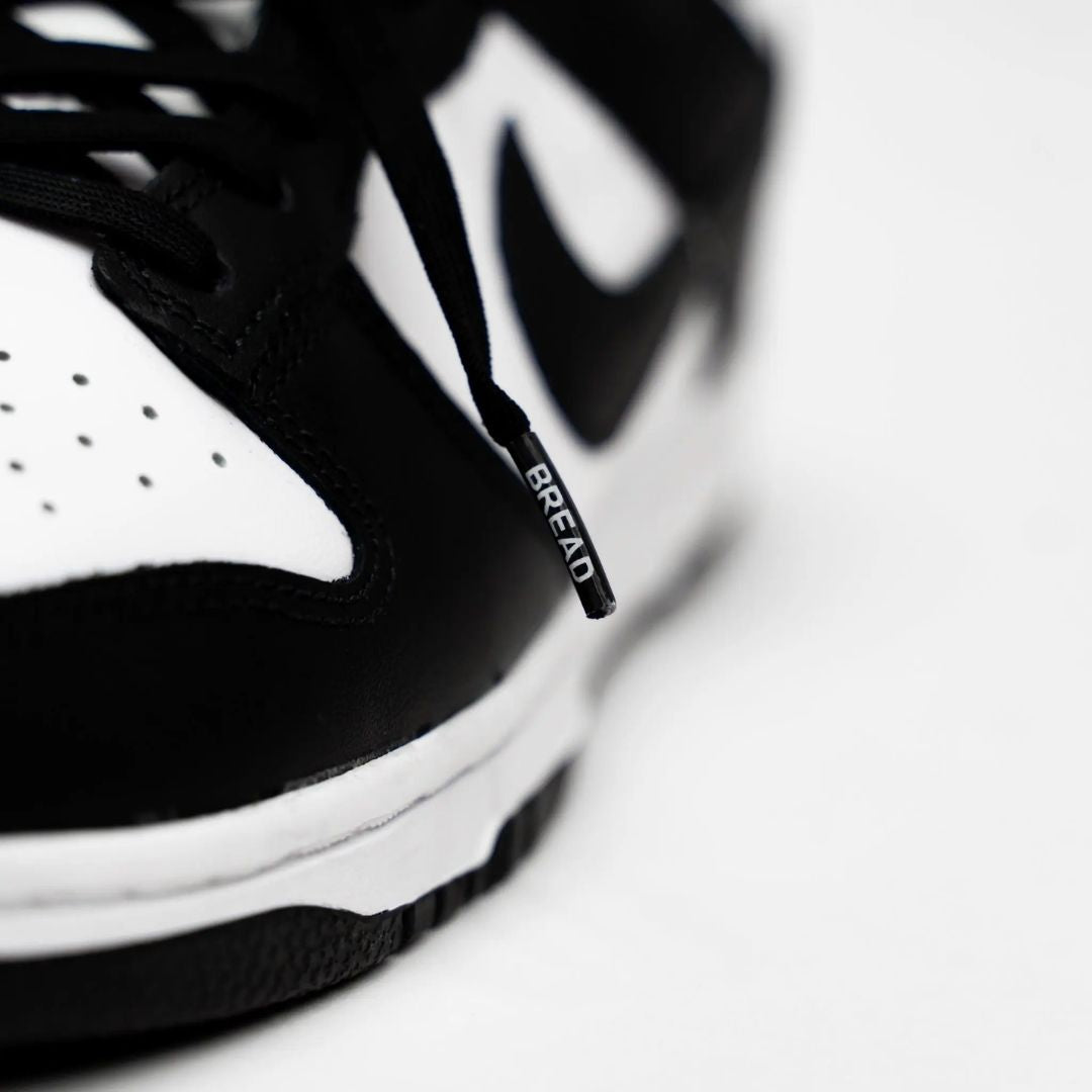 Black elastic shoelaces by Bread, showcasing a close-up of the flexible, durable shoelaces against a neutral background.