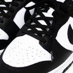 Black elastic shoelace by Bread, shown in a close-up image highlighting its flexible, stretchable design and sleek shadow black color.