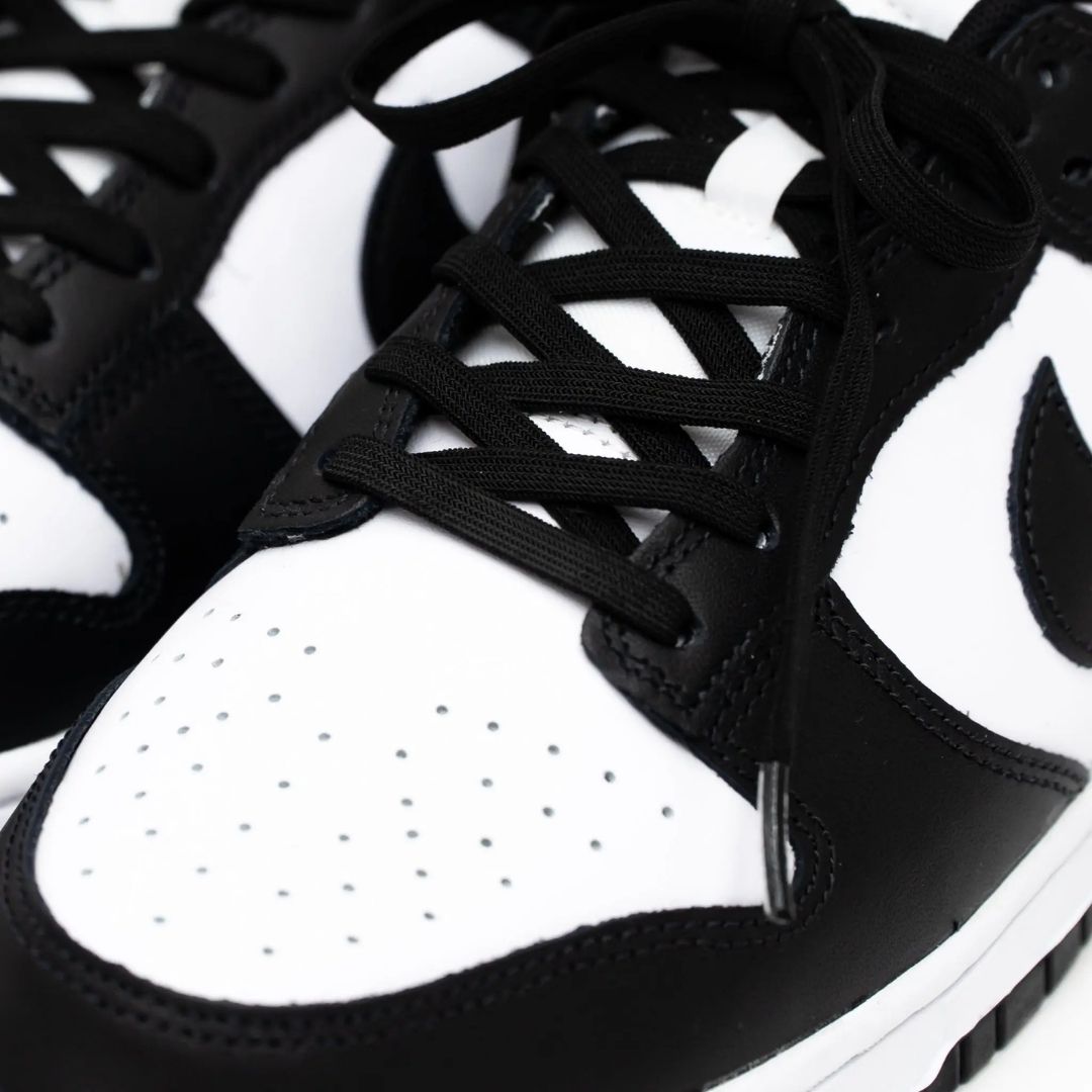 Black elastic shoelace by Bread, shown in a close-up image highlighting its flexible, stretchable design and sleek shadow black color.
