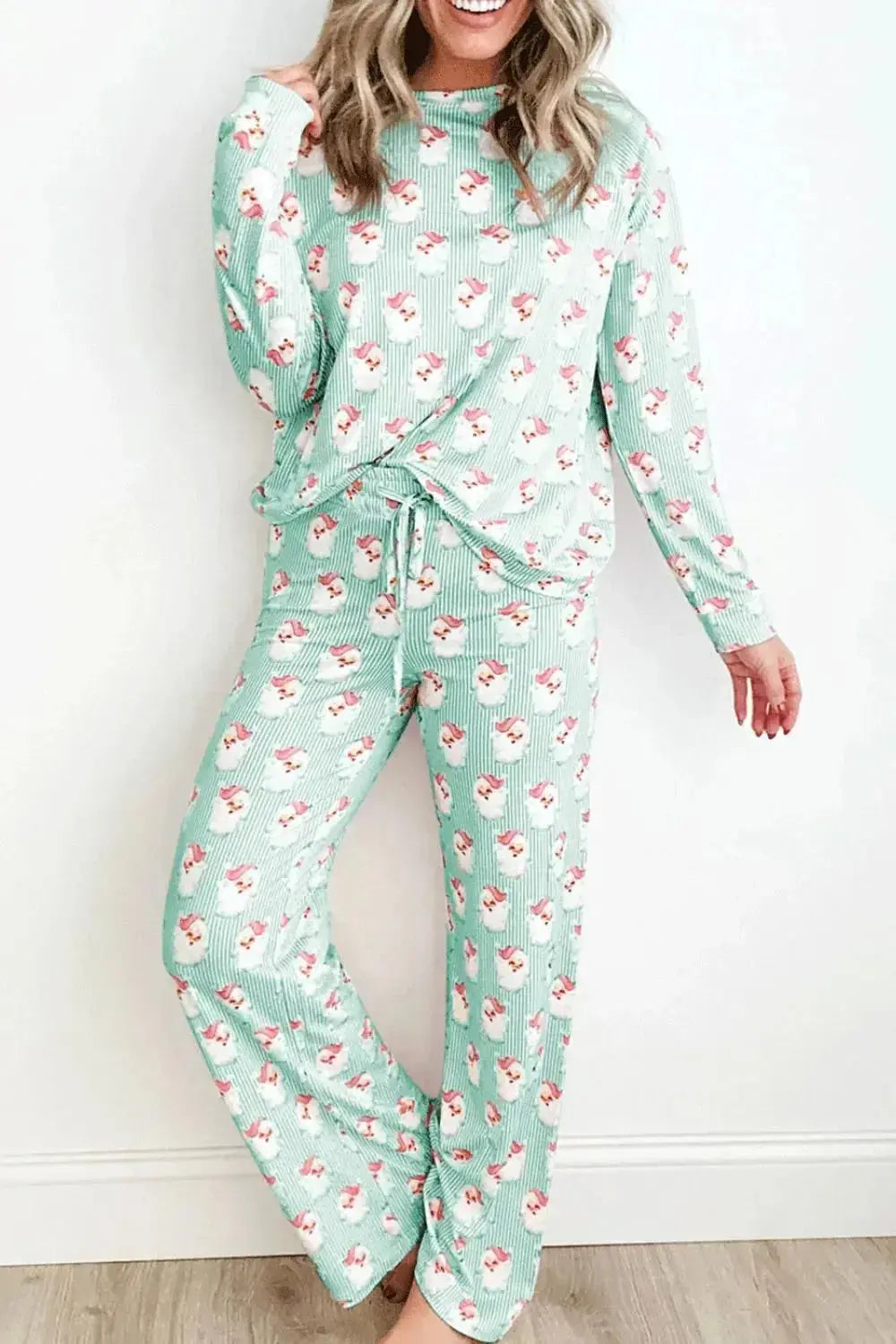 Women’s festive Santa print long sleeve pajama lounge set by Trendsi, featuring comfortable soft fabric and holiday-themed design.