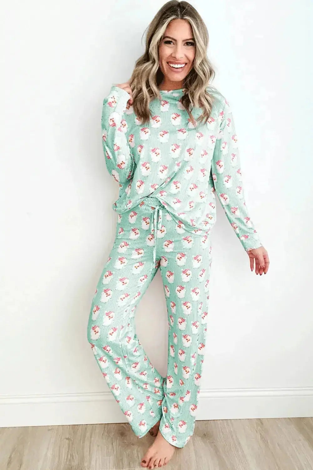 Women’s festive Santa print long sleeve pajama lounge set by Trendsi, featuring cozy holiday-themed pajamas with Santa print.