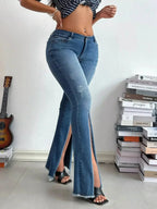 Women's high-rise distressed slit flare jeans in vintage-inspired denim, showing the stylish distressed details and flared leg design.