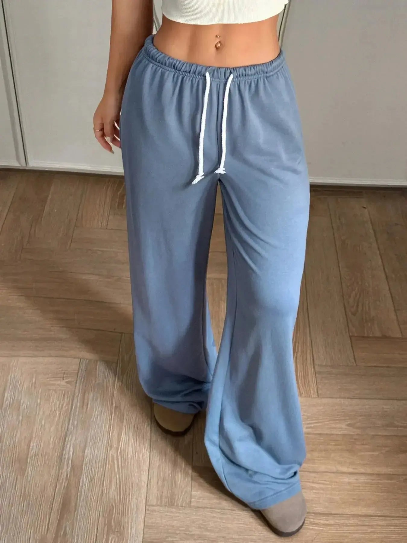 Women’s high-waisted wide-leg drawstring pants with pockets, stylish Trendsi casual pants for comfort and fashion.