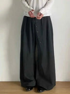 Women’s loose-fit, high-waisted trousers with button details from Plush Fashion Hub, ideal for a relaxed, stylish look.