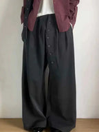 Women’s loose-fit high-waisted trousers with button details from Plush Fashion Hub, stylish long suit trousers for a relaxed look.