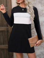 Plus size women's color block long sleeve casual mini dress by Trendsi, featuring a stylish color block design and relaxed fit.