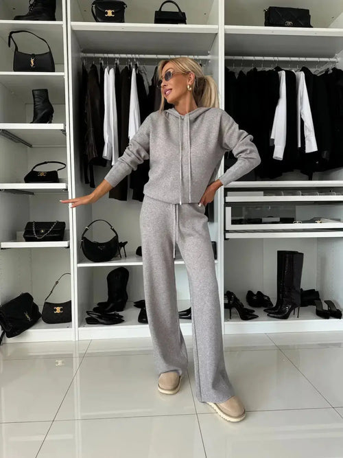 Women's solid color hooded sweatshirt and wide leg pant lounge set from Plush Fashion Hub, casual activewear outfit.