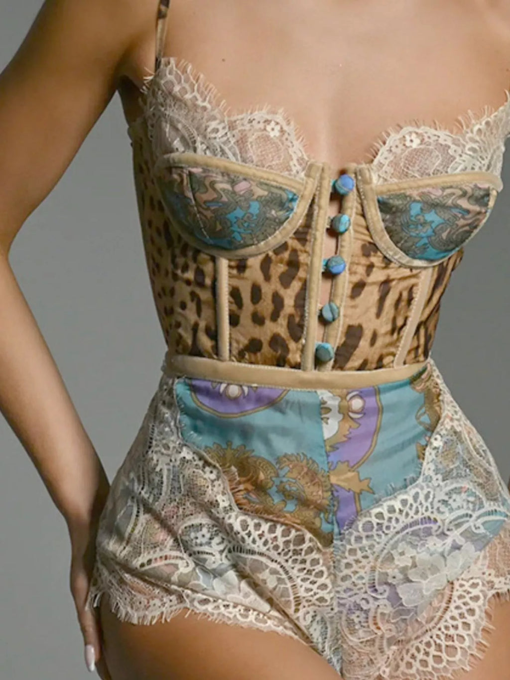 Leopard print lace trim romper by Trendsi featuring a stylish sleeveless design and lightweight fabric for a chic look.