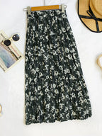 Floral print elastic waist midi skirt from Trendsi, flowing fabric with vibrant flower patterns, stylish and comfortable for everyday wear.
