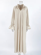 Cotton linen maxi dress with tie neck and flounce sleeves, Trendsi fashion, featuring a flowy silhouette and stylish design.