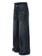 Men's washed wide-leg jeans from Trendsi, showing relaxed fit and faded denim fabric on a neutral background.