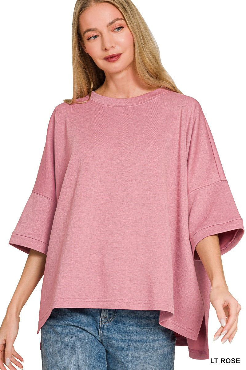 Women's scuba round neck top by Trendsi, relaxed fit shirt with side slits, soft fabric, and comfortable design.