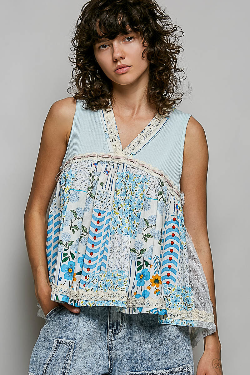 Floral V-neck sheer tank top with lace trim by Trendsi, featuring a delicate floral pattern and elegant neckline.
