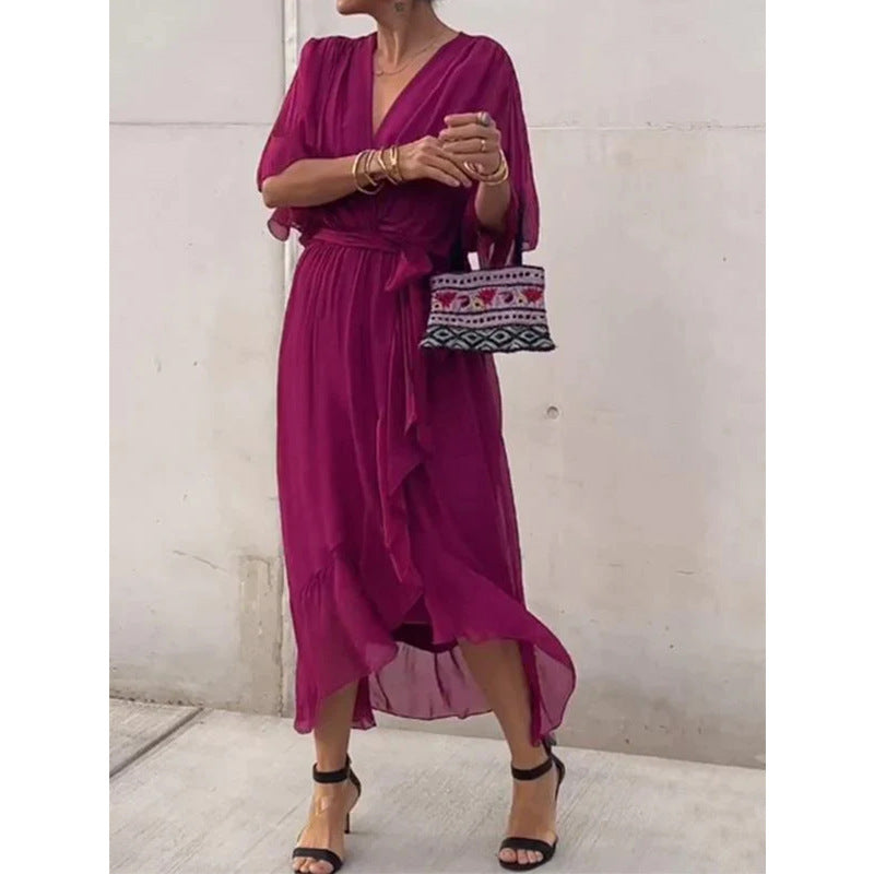 Plush Fashion Hub batwing sleeve v-neck midi dress with tied irregular hem, airy fairy dress style, shown on a model.