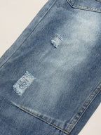 Distressed denim jeans from Plush Fashion Shop featuring front and back pockets, with a casual, worn-in style.