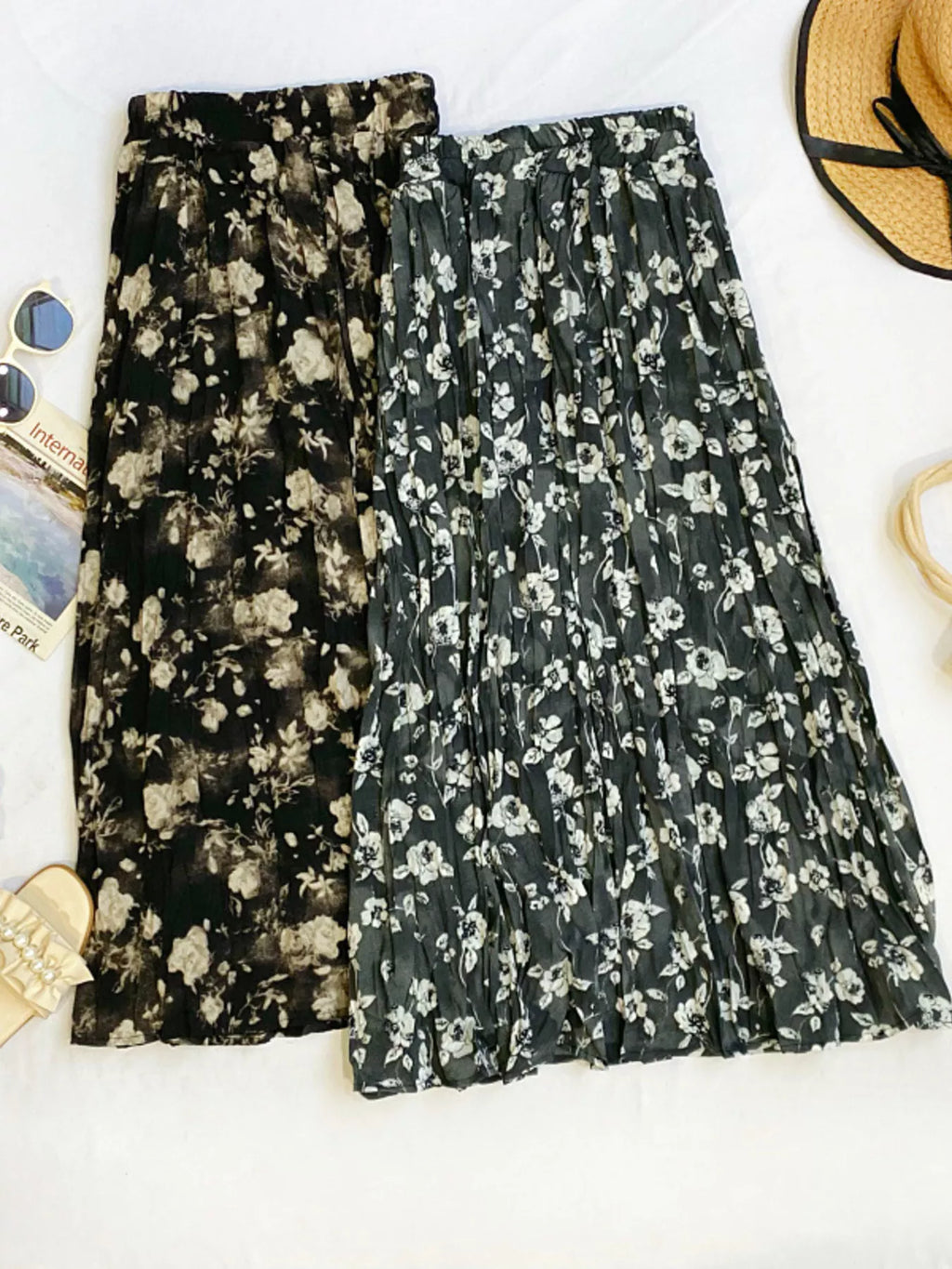 Floral print elastic waist midi skirt by Trendsi, featuring a flowy design with colorful flower patterns and comfortable fit.