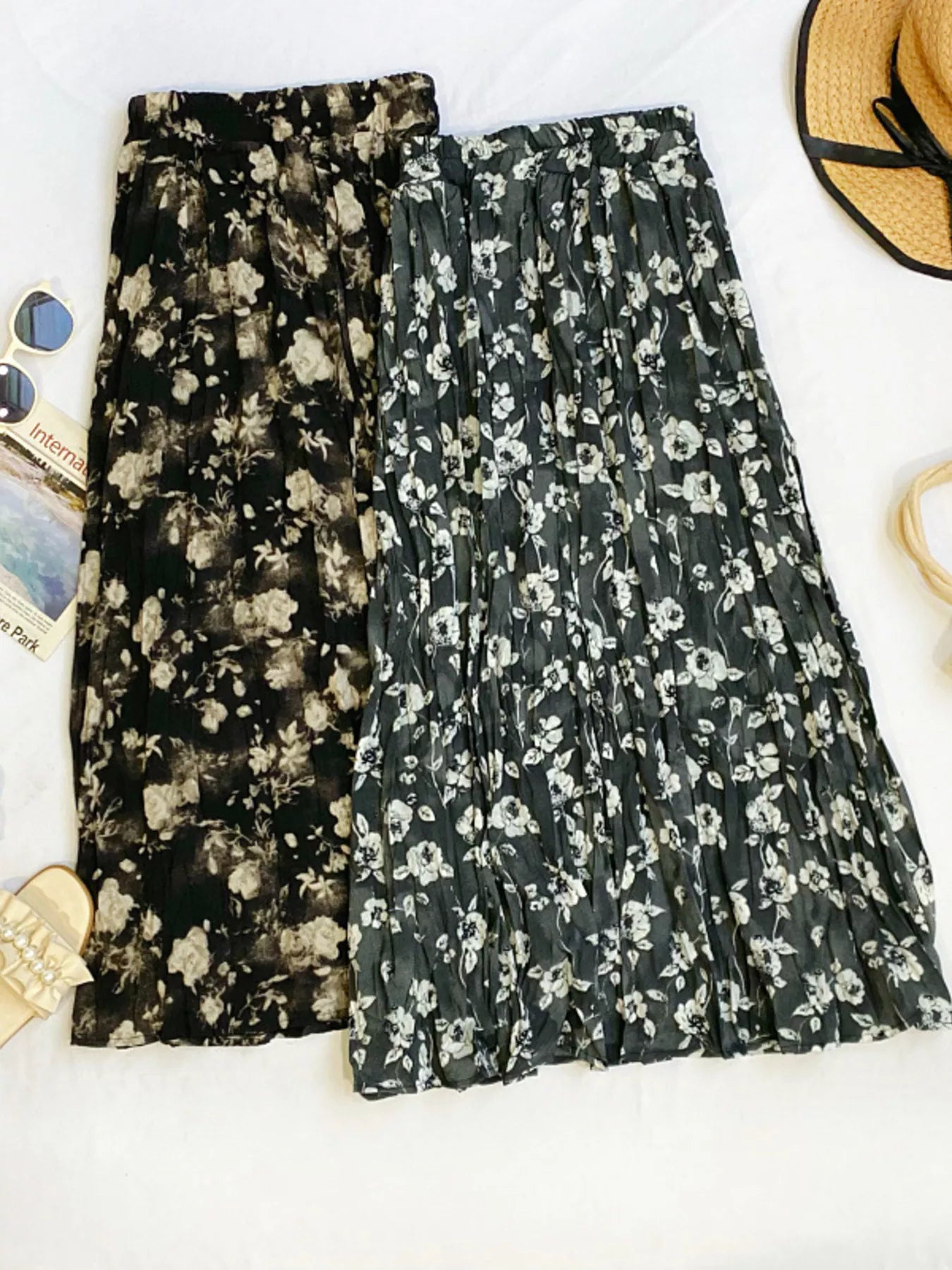 Floral print elastic waist midi skirt by Trendsi, featuring a flowy design with colorful flower patterns and comfortable fit.