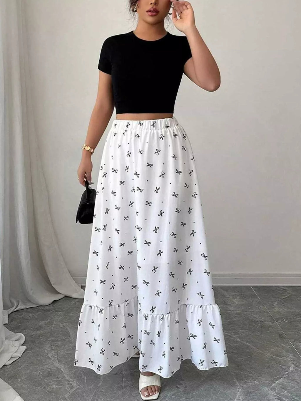 Bowknot print ruffle hem maxi skirt from Trendsi featuring a flowing design with a bowknot pattern and ruffled hem detail.