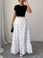 Bowknot print ruffle hem maxi skirt from Trendsi featuring a flowing design with a bowknot pattern and ruffled hem detail.