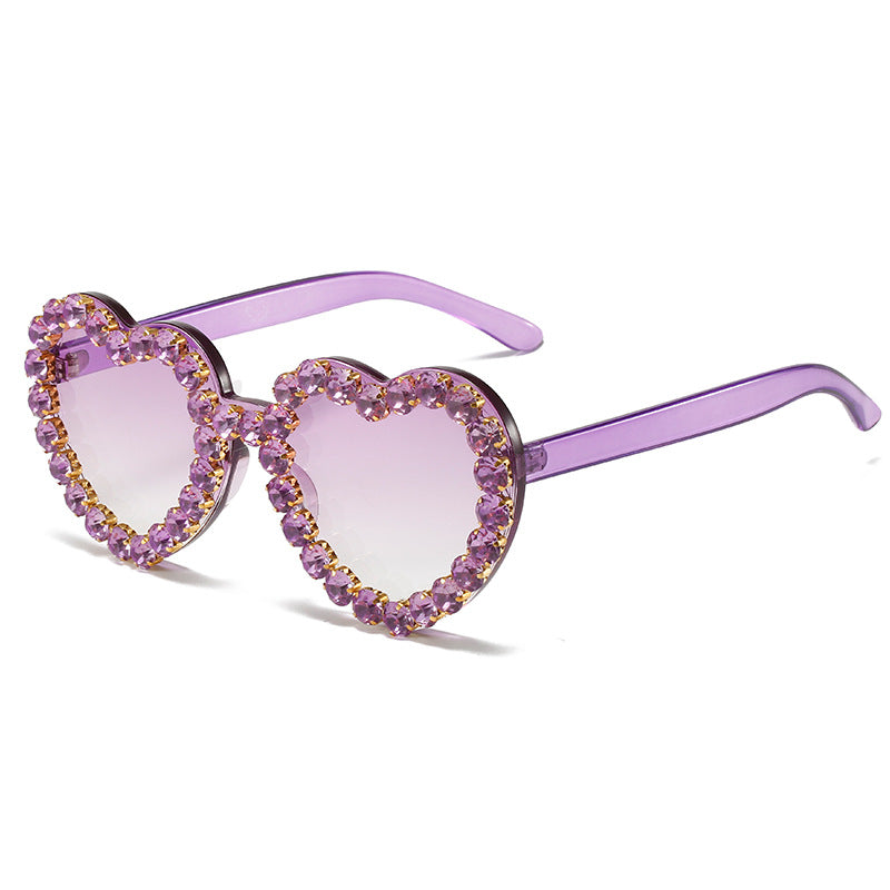 Peach heart-shaped rhinestone sunglasses by FitiqueFit featuring Y2K-inspired eyewear with sparkling rhinestones and bold heart design.