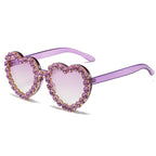 Peach heart-shaped rhinestone sunglasses by FitiqueFit featuring Y2K-inspired eyewear with sparkling rhinestones and bold heart design.