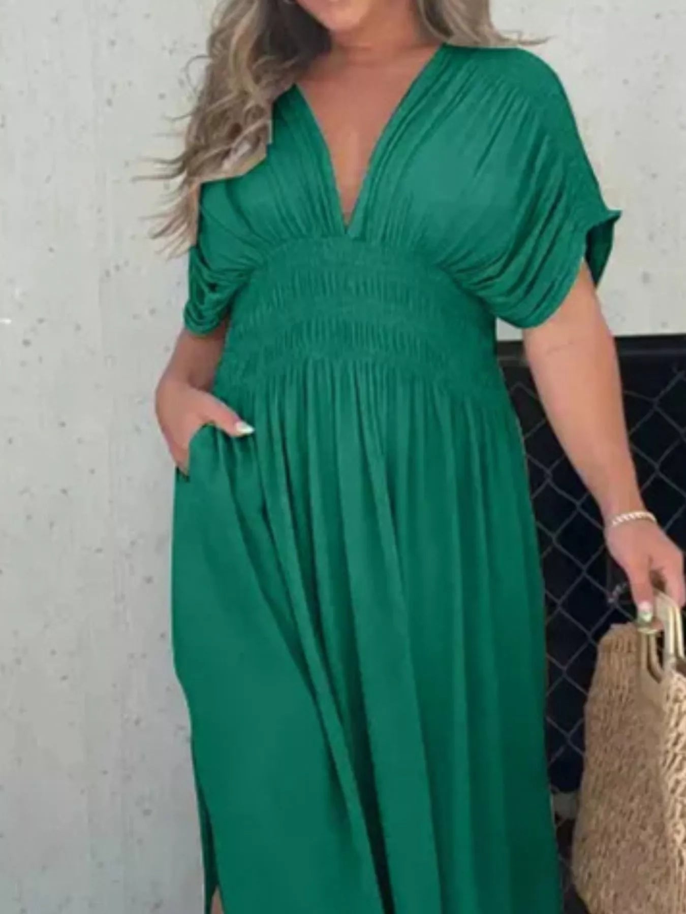 Plus size full-length maxi dress featuring a slit, V-neck, smocked waist, and trendy style by Trendsi.