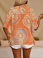Women's printed V-neck casual top by Trendsi, soft stretch fabric, half sleeves, perfect for office or casual wear.