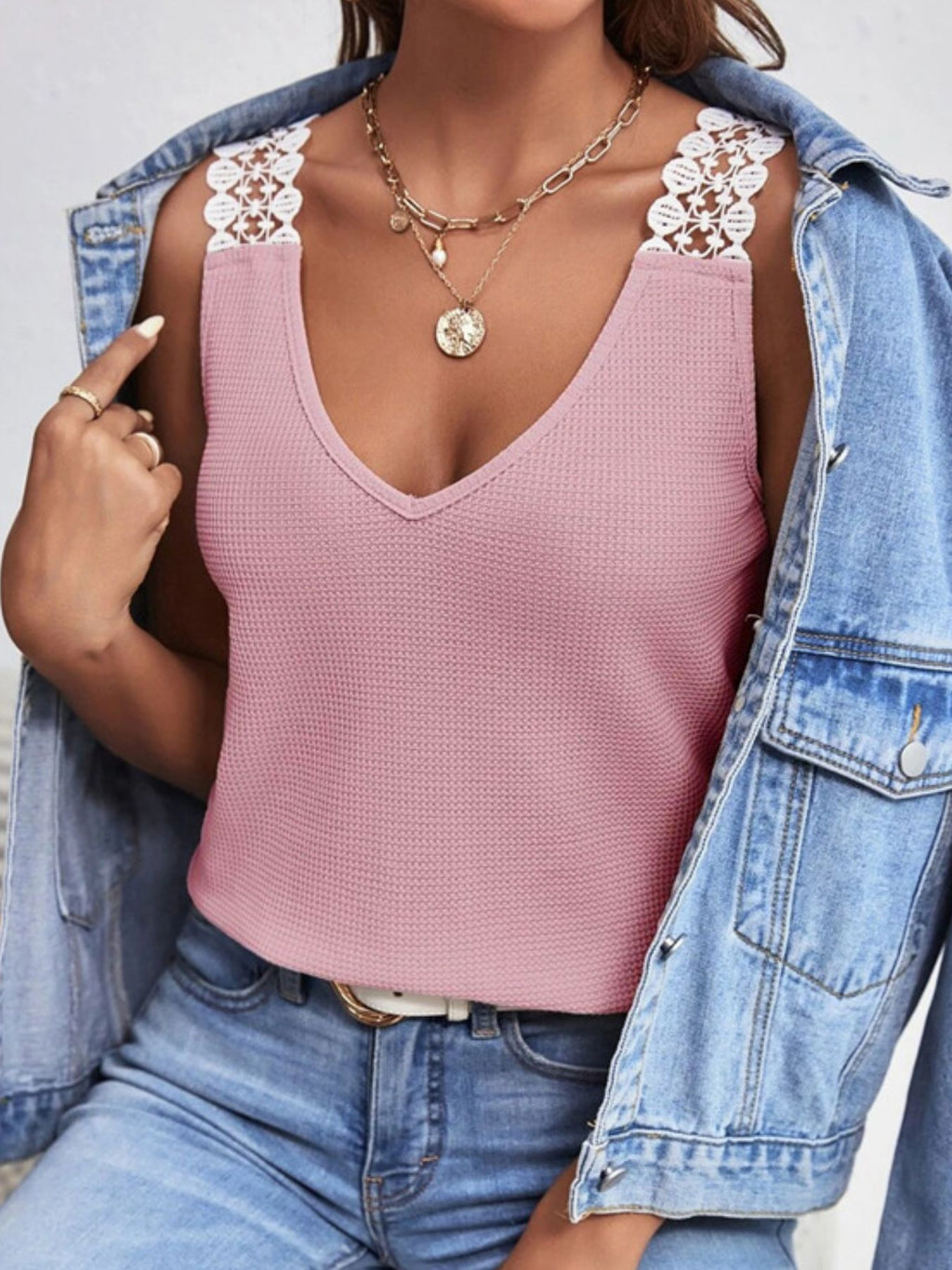 Women's V-neck waffle knit tank top with delicate lace trim, soft and lightweight, from Trendsi.