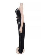 Sleeveless tube top and wide-leg pants set by Trendsi, featuring a stylish matching outfit with a fitted tube top and flowy pants.
