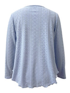 Elegant women's eyelet long sleeve blouse by Trendsi featuring a stretchy, versatile office top with eyelet details and long sleeves.