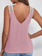 Women's V-neck waffle knit tank top with delicate lace trim, featuring a comfortable sleeveless design and stylish casual look.
