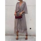 Plush Fashion Hub batwing sleeve v-neck midi dress with tied irregular hem, flowing fabric and elegant design.