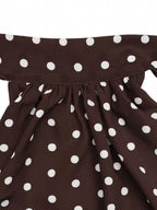 Polka dot halter neck mini dress by Trendsi featuring a fitted silhouette and stylish design, perfect for summer occasions.