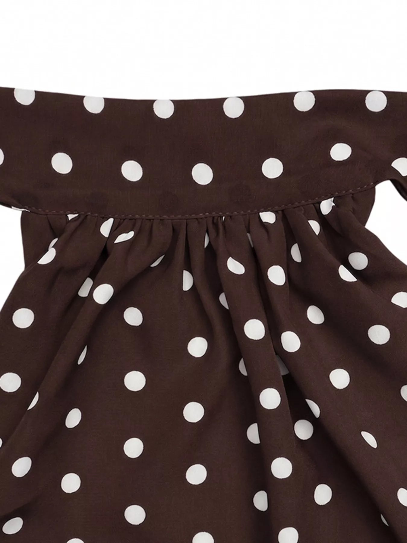 Polka dot halter neck mini dress by Trendsi featuring a fitted silhouette and stylish design, perfect for summer occasions.