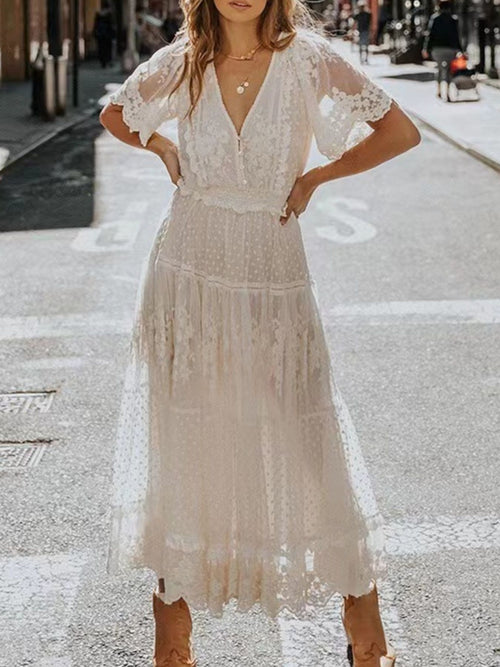 Elegant bohemian lace maxi dress with short sleeves, flowing plus size gown by Trendsi. Perfect for stylish, comfortable wear.