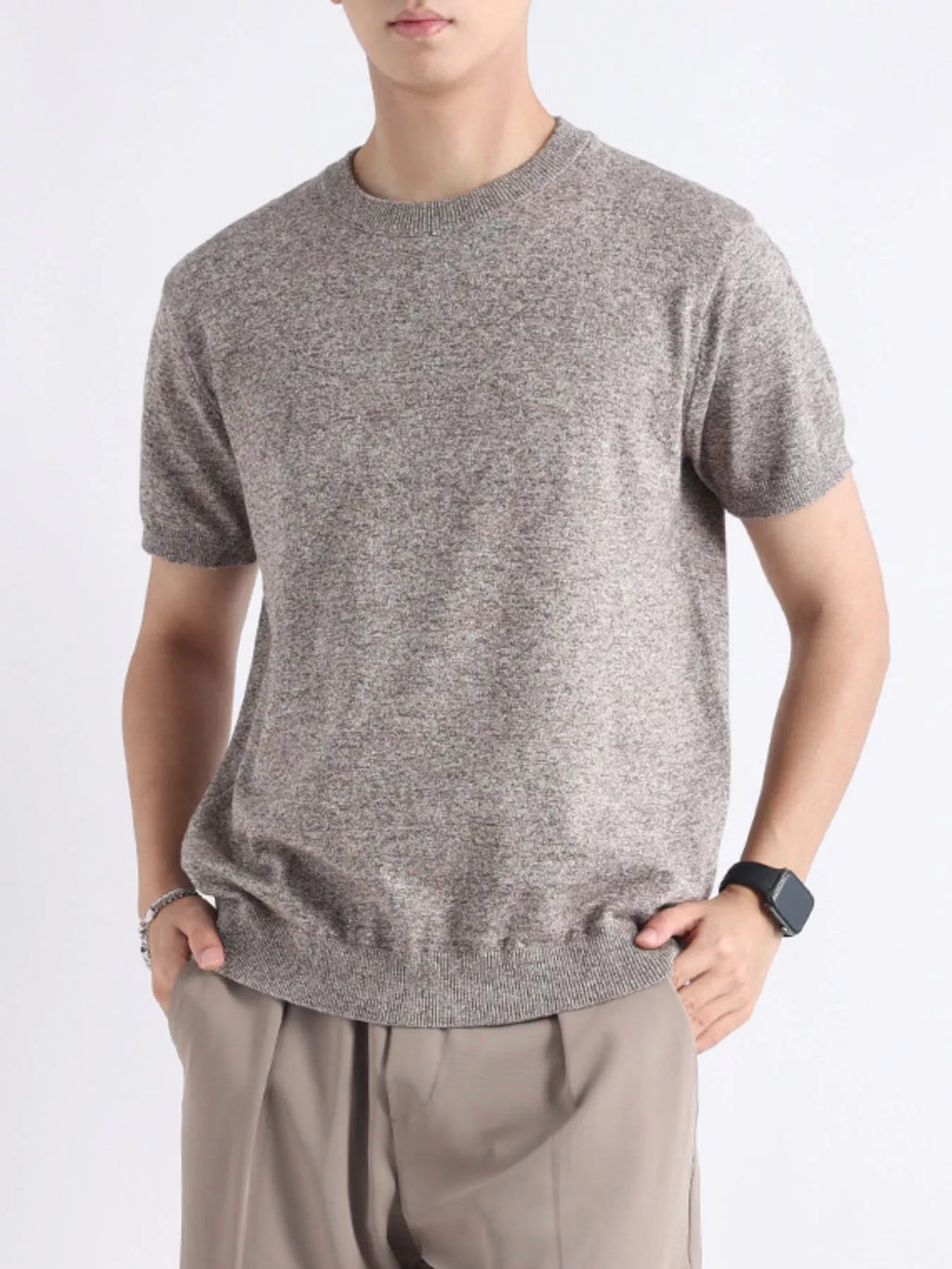 Men's plus size casual knitted short sleeve T-shirt from Trendsi, featuring a comfortable, stylish design in a relaxed fit.