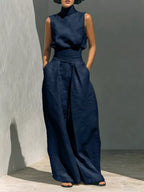 Sleeveless turtleneck top and wide-leg pants set from Trendsi, featuring a stylish, coordinated outfit in neutral tones.