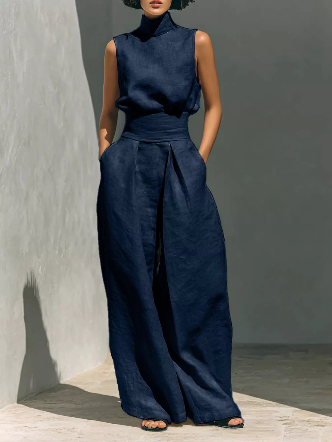 Sleeveless turtleneck top and wide-leg pants set from Trendsi, featuring a stylish, coordinated outfit in neutral tones.
