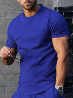 Men's plus size solid color casual T-shirt by Trendsi, showcasing a comfortable fit and simple design in a neutral color.