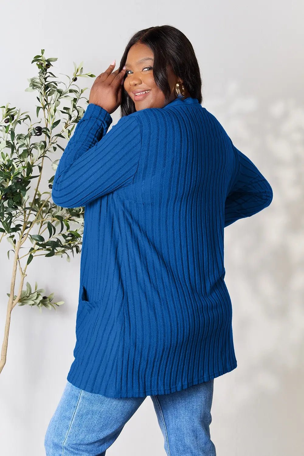 Women's ribbed open front cardigan with functional pockets, lightweight and casual, from Trendsi, shown in a full-size view.