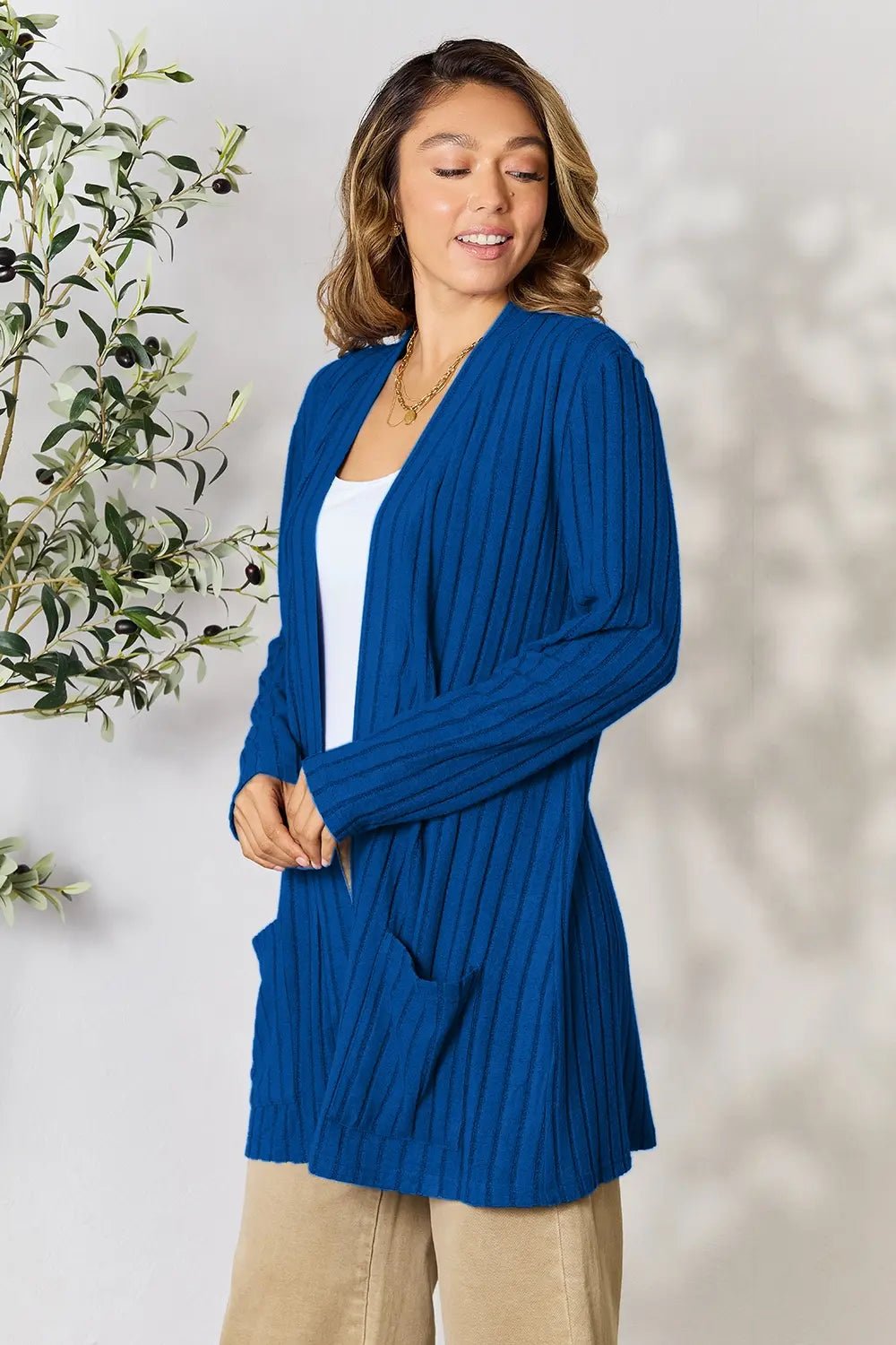 Women’s ribbed open front cardigan with functional pockets, lightweight and cozy, perfect for casual layering by Trendsi.