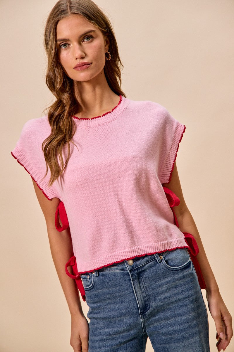 Women's lightweight dolman sleeve sweater with side ribbon tie, stylish shirt by Plush Fashion Hub, shown in the image.